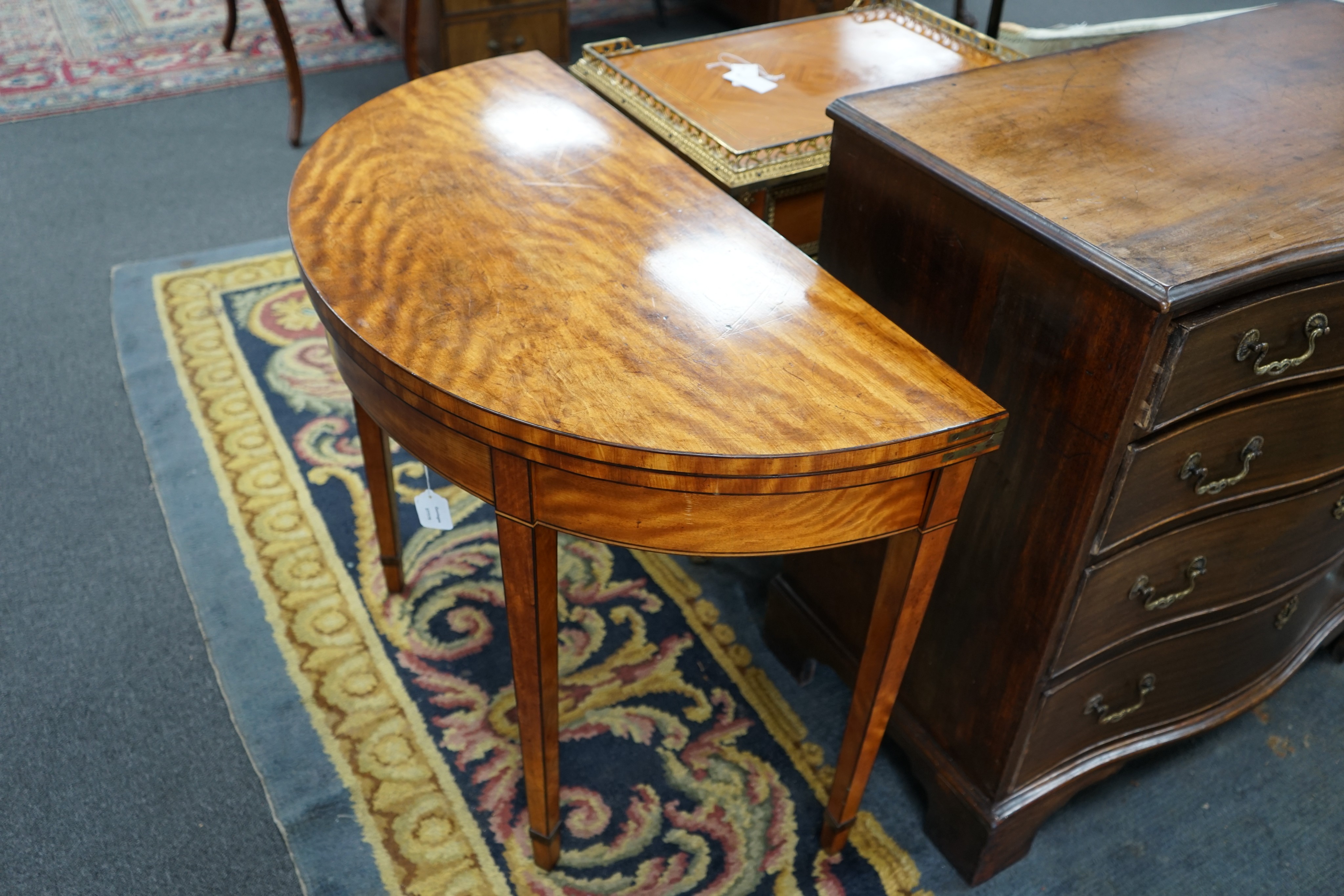 A George III satinwood demi lune folding card table, width 97cm, depth 47cm, height 73cm